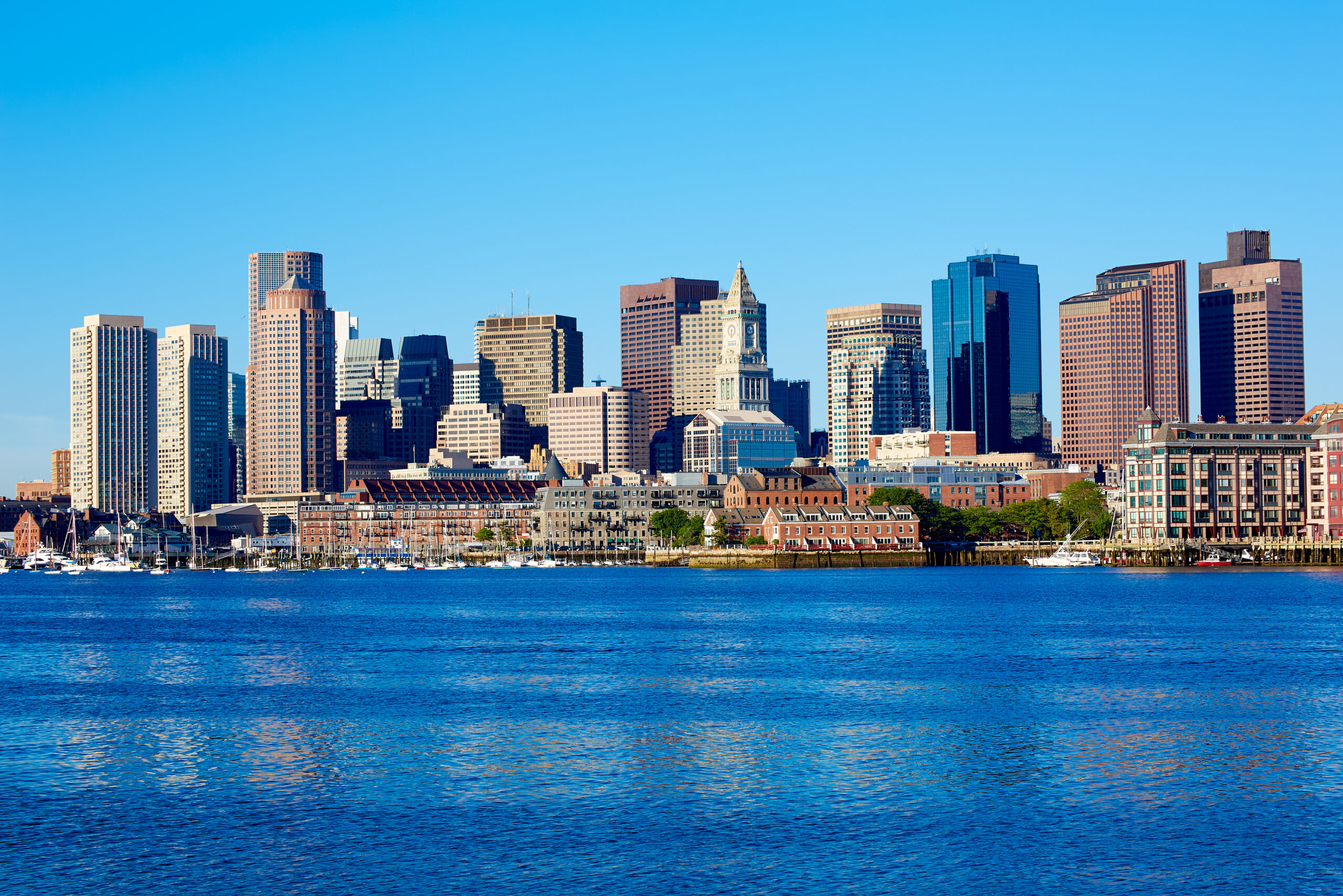 Boston skyline view from the harbor on a clear day