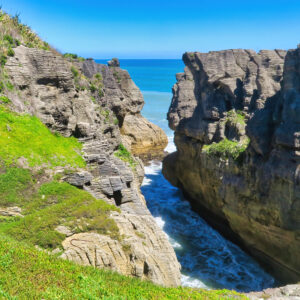 Pancake Rocks at Punakaiki with ocean waves below cliffs