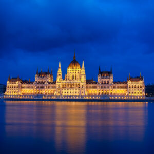 Budapest Parliament at night with reflection in Danube river